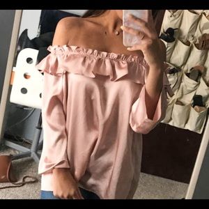 pink ruffled blouse